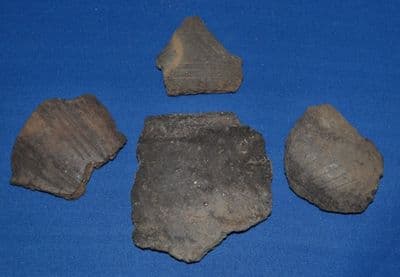 A nice group of 4 assorted Early Anglo Saxon Pagan period pottery fragments, several decorated from Icklingham, Suffolk.  SOLD