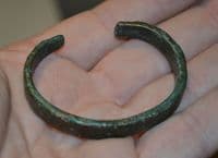 A nice, robust and wearable Celtic bronze open ended bangle.