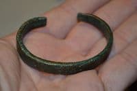 A nice, robust and wearable Celtic bronze open ended bangle.