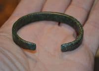 A nice, robust and wearable Celtic bronze open ended bangle.