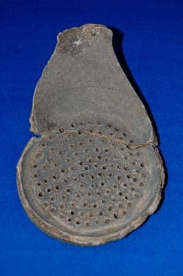 A pair of large pottery segments from a very rare Anglo Saxon strainer bowl, found in Suffolk. SOLD