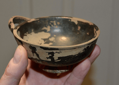 A pleasant Ancient Greek (Apulian) single handled terracotta drinking cup, Southern Italian, SOLD