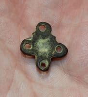 A pleasant and unusual Anglo Saxon embossed bronze four way decorative mount, Kent. SOLD