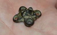 A pleasant and unusual Anglo Saxon embossed bronze four way decorative mount, Kent. SOLD