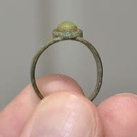 A pleasant post-Medieval Ladies bronze finger ring with inset green stone, Yorkshire. SOLD