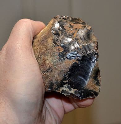 A rare, large and attractive Early Lower Paleolithic flint Pebble Chopper, Pakefield, Suffolk. SOLD