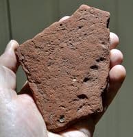A rare segment of Roman terracotta roof tile featuring a childs fingerprints (K2)