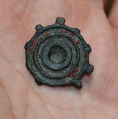 A Roman bronze circular plate brooch with traces of original red enamelling, Yorkshire. SOLD