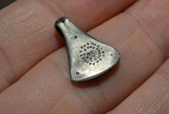 A scarce and excellent Celtic silver Axe pendant with punched decoration on either side. SOLD