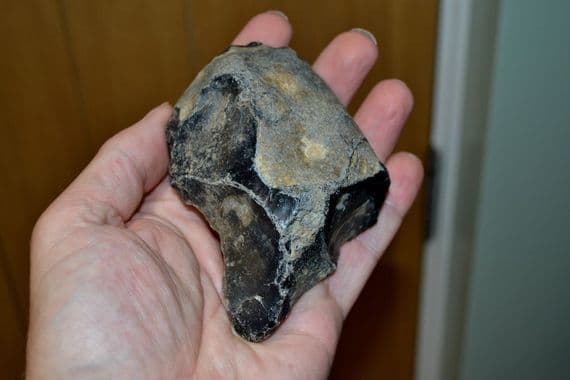A scarce and excellent Lower Paleolithic pointed unifacial flint hand axe, Hoxne, Suffolk. SOLD