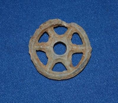 A scarce and unusual lead wheel from a Roman childs pull along toy horse or chariot, London. SOLD