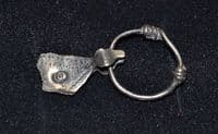 A scarce and unusual Viking silver axe pendant on its original suspension loop, Eastern Europe. SOLD