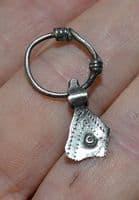 A scarce and unusual Viking silver axe pendant on its original suspension loop, Eastern Europe. SOLD