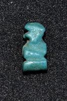 A small stylised Ancient Egyptian Faience amulet of Ptah Sokar (Dwarf God) SOLD