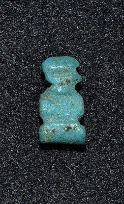 A small stylised Ancient Egyptian Faience amulet of Ptah Sokar (Dwarf God) SOLD