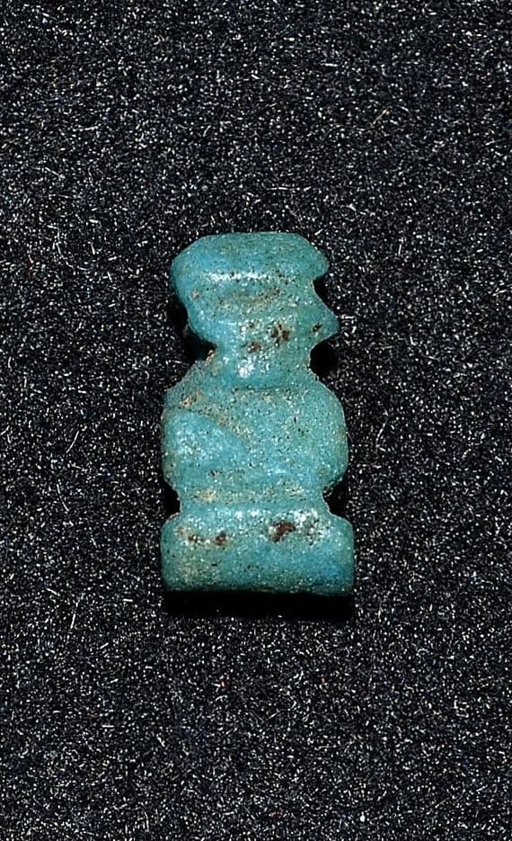 A small stylised Ancient Egyptian Faience amulet of Ptah Sokar (Dwarf God) SOLD