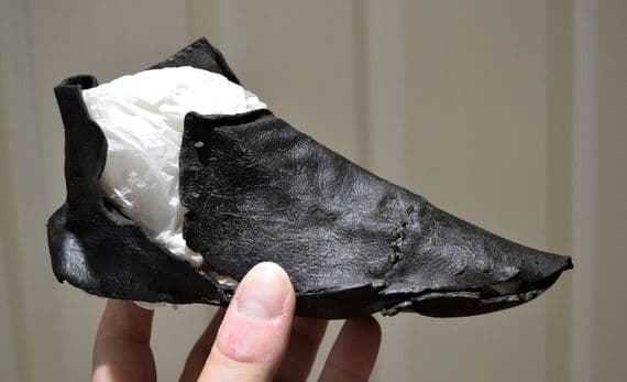 A very rare and largely complete Medieval leather shoe from Queenshithe, River Thames, London. Recorded and conserved by the Museum of London. SOLD