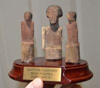 An attractively mounted group of 3 x Ancient Egyptian wooden funerary boatmen, Thebes. SOLD