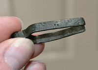 An excellent and still functional pair of Medieval bronze tweezers with punched decoration from Norfolk. SOLD