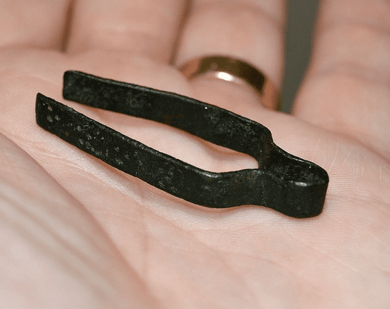 An excellent and still functional pair of Medieval bronze tweezers with punched decoration from Norfolk. SOLD