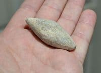 An excellent and unusually large Roman Military lead ovoid sling shot, European. SOLD