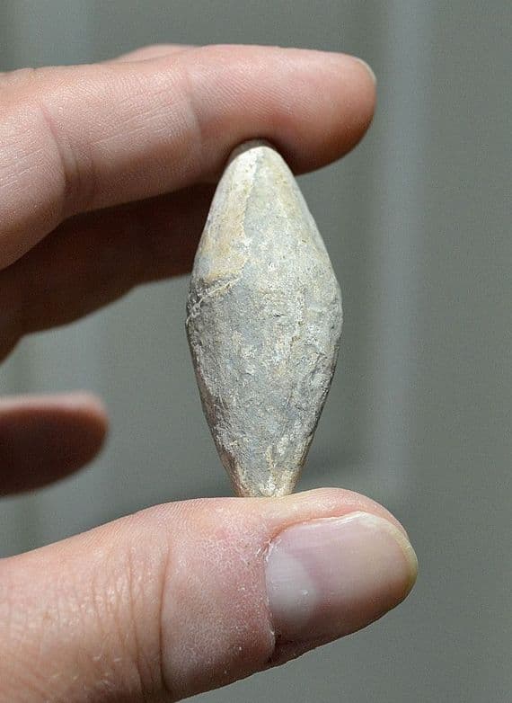 An excellent and unusually large Roman Military lead ovoid sling shot, European. SOLD