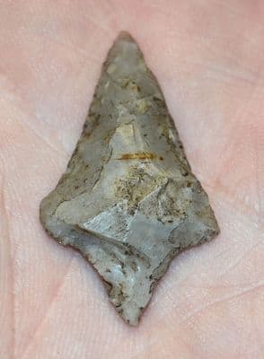 An excellent Neolithic flint triangular arrowhead with pointed tang, found Scottish borders. SOLD