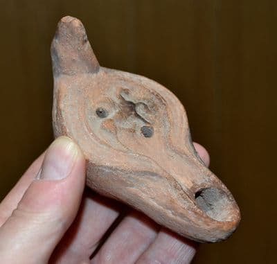 An excellent Roman terracotta oil lamp featuring Horse & Rider design, Palestine. SOLD