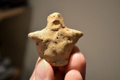 An extremely Rare and totally intact Early Neolithic hand modelled clay mother Goddess votive figurine. SOLD