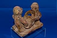 An extremely rare Pre-classic period Mayan pottery figurative oil lamp. SOLD