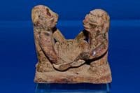 An extremely rare Pre-classic period Mayan pottery figurative oil lamp. SOLD