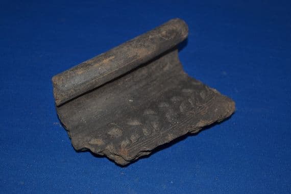 An impressive decorated rim section from a large Late Iron Age storage jar, found Brantham, Suffolk. SOLD