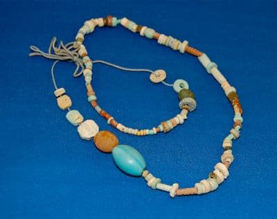 An interesting string of around 100 varied Ancient Egyptian multi-coloured beads & amulets. SOLD