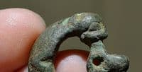 An unusual and sizable Anglo Saxon bronze buckle featuring the heads of two beasts, Yorkshire. SOLD