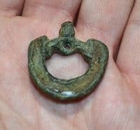 An unusual and sizable Anglo Saxon bronze buckle featuring the heads of two beasts, Yorkshire. SOLD
