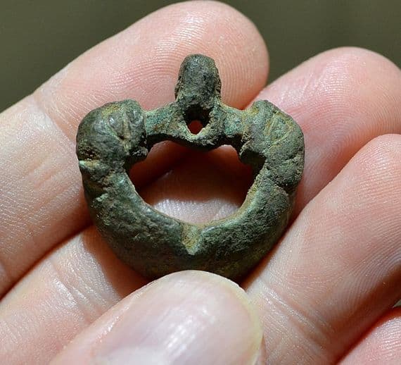 An unusual and sizable Anglo Saxon bronze buckle featuring the heads of two beasts, Yorkshire. SOLD