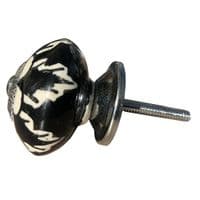 Dramatic black knob