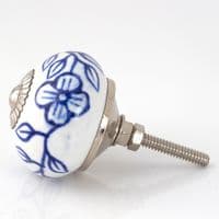 White knob with blue flowers