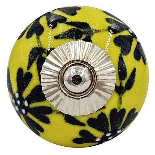 Yellow knob with black flowers