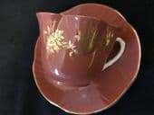 Crown Staffordshire burnt orange cup & saucer