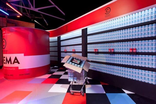 Empty sealed tins used as visual props on a TV studio set