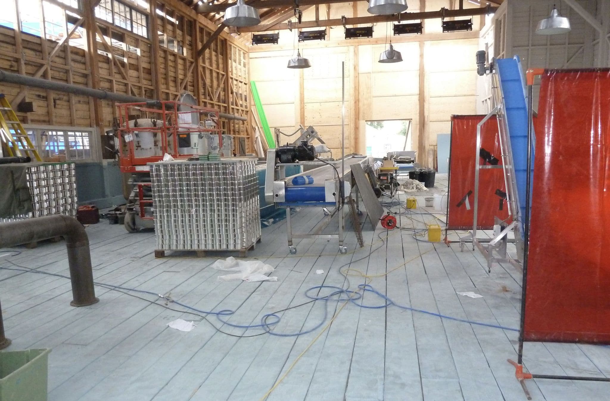 Exterior film set depicting a constructed harbour and cannery environment