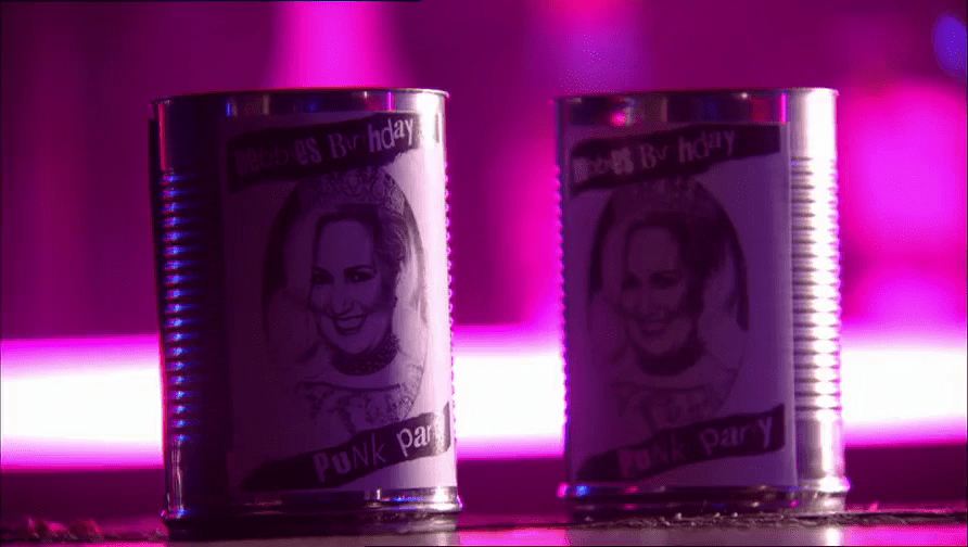 Cocktail cups made from steel cans shown under purple event lighting