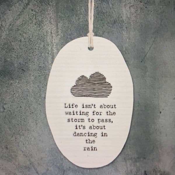 Life isn't about waiting for the storm to pass - hanging love token