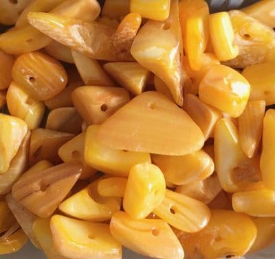 50 Amber coloured misshapes. 5mm to 10mm