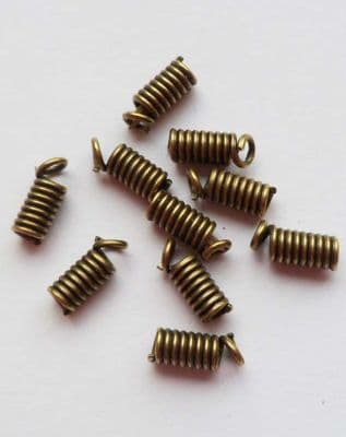 Antique bronze coil crimp x 50. 8mm x 3mm.
