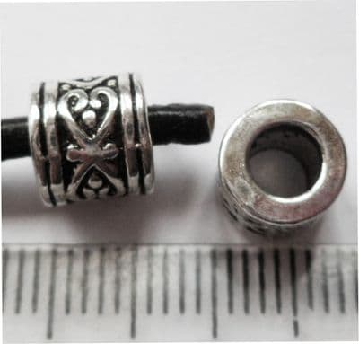 Barrel bead with large 4.35mm hole. 7mm x 7mm