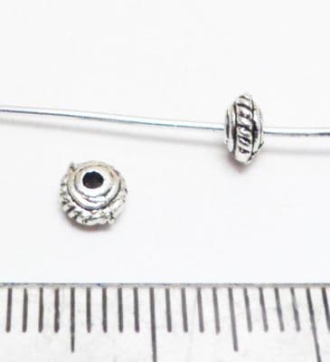 Disc spacer x 50. Tibetan Style silver. 5mm.