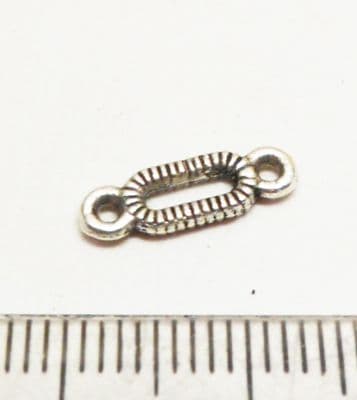 Oval ridged connectors Silver. x12. 13mm x 4mm.