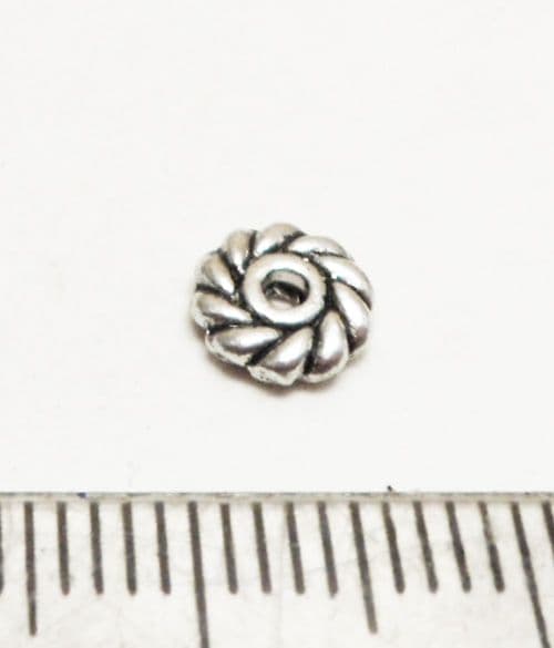 Swirl disc spacer bead. Tibetan style silver